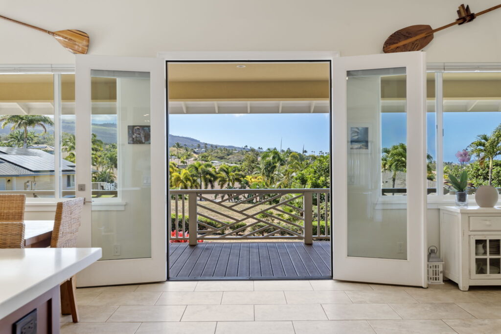 Maui Home with open doors looking out onto a lanai with views of Maui